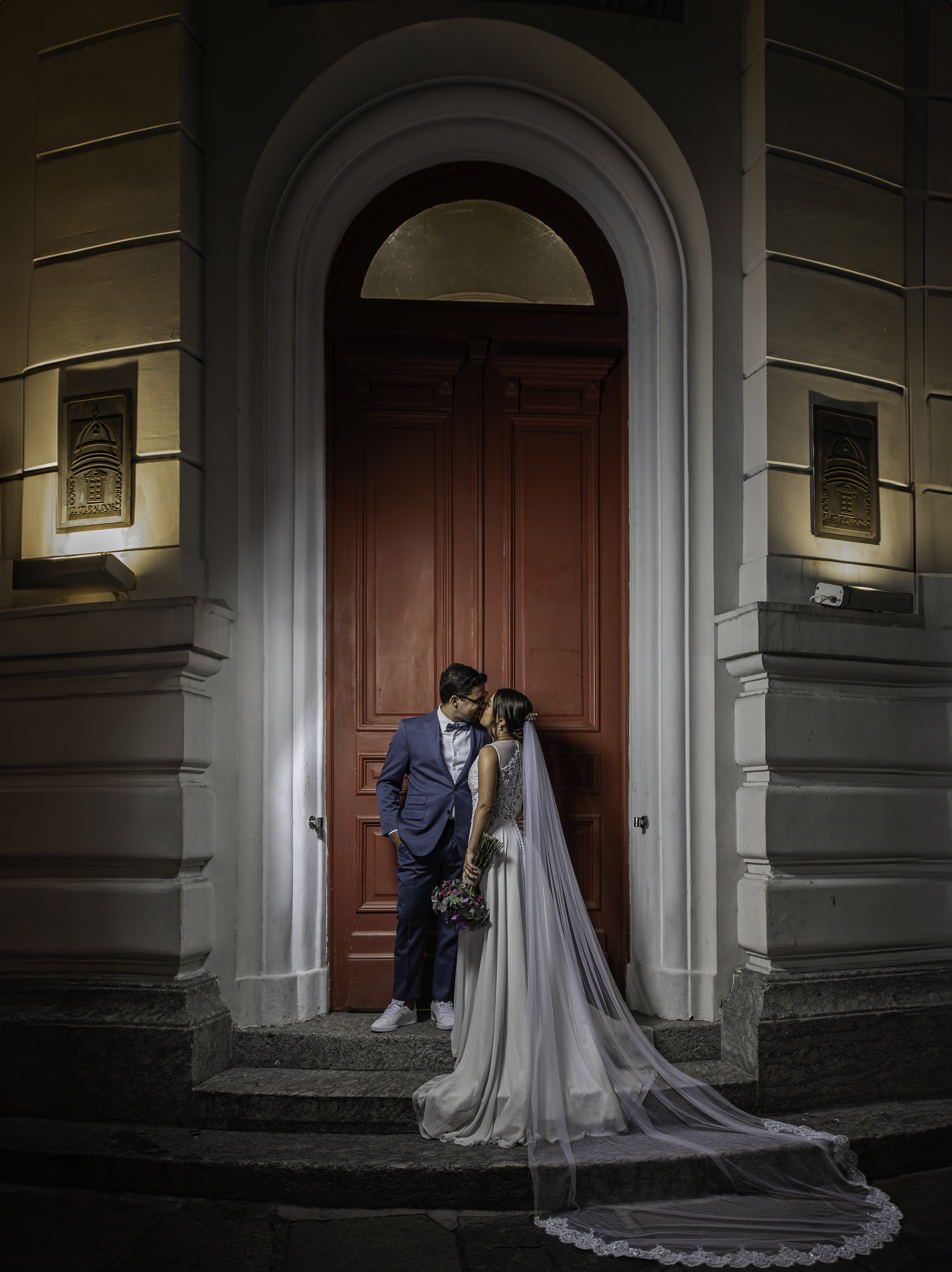Couple kissing at historic red door at night, Rio de Janeiro wedding